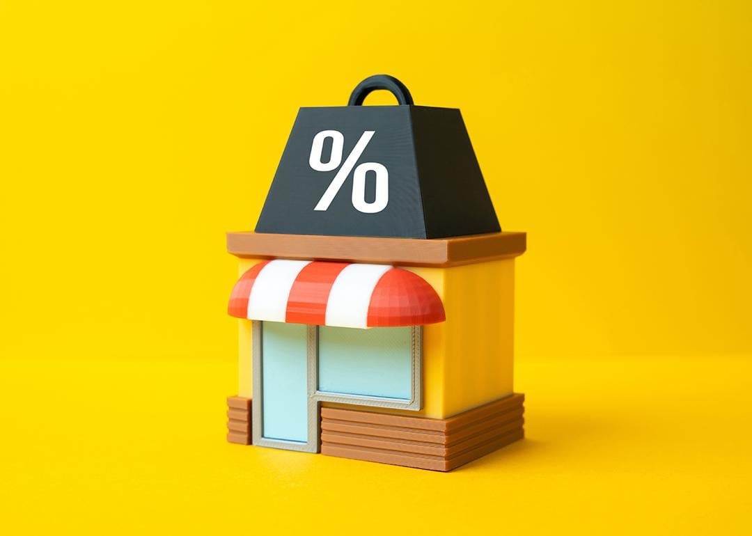 3D conceptual illustration of a small business under pressure from tax.