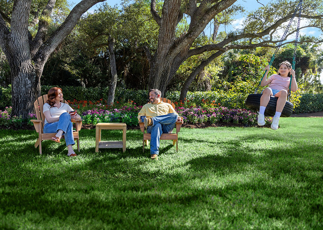 A family enjoying their time in the house yard.