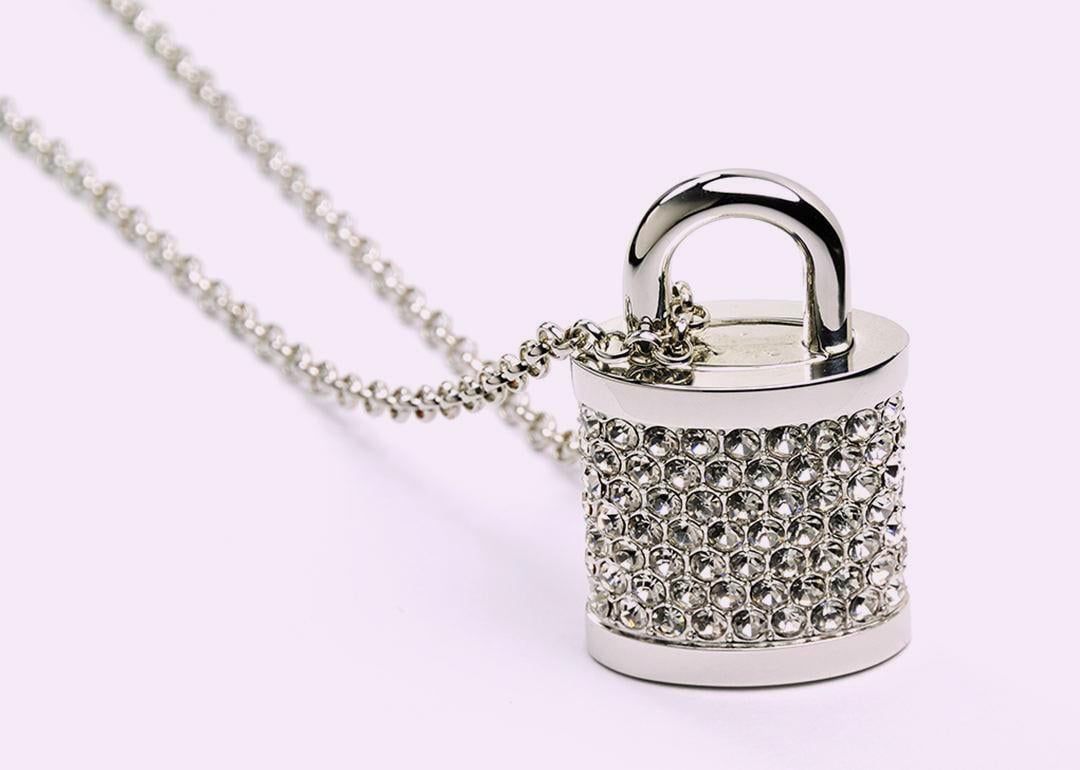 A bejeweled padlock with a string.