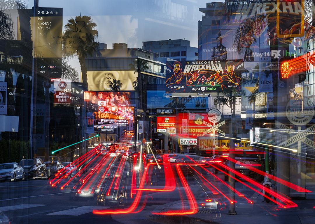 A slow exposure shot resulting in a mosaic of streaming car lights in a sea of billboards on Sunset Boulevard in West Hollywood.