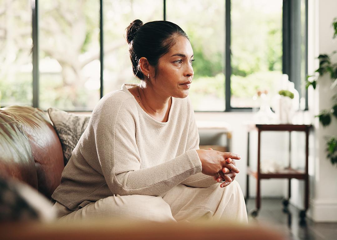 A person taking her time for calm contemplation and reflection at home.