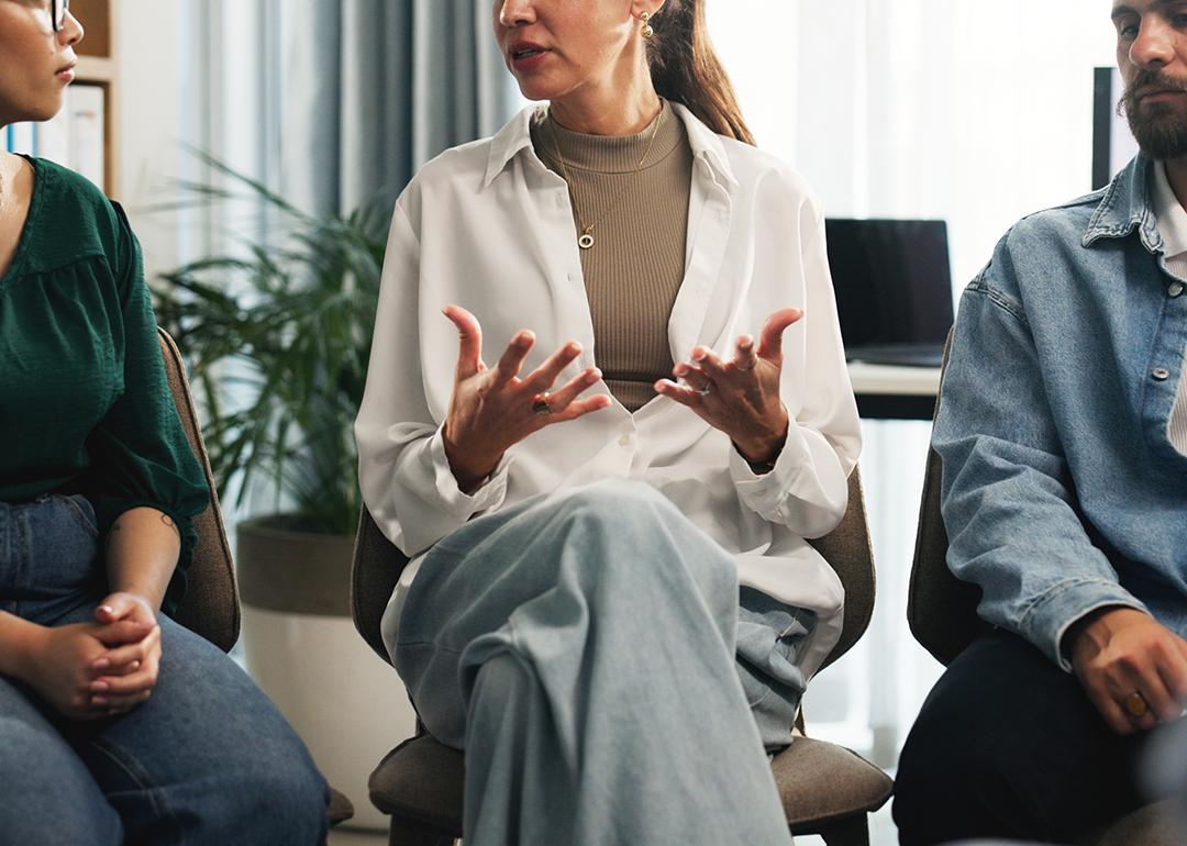 A small group of employees discussing about stress management in the workplace.