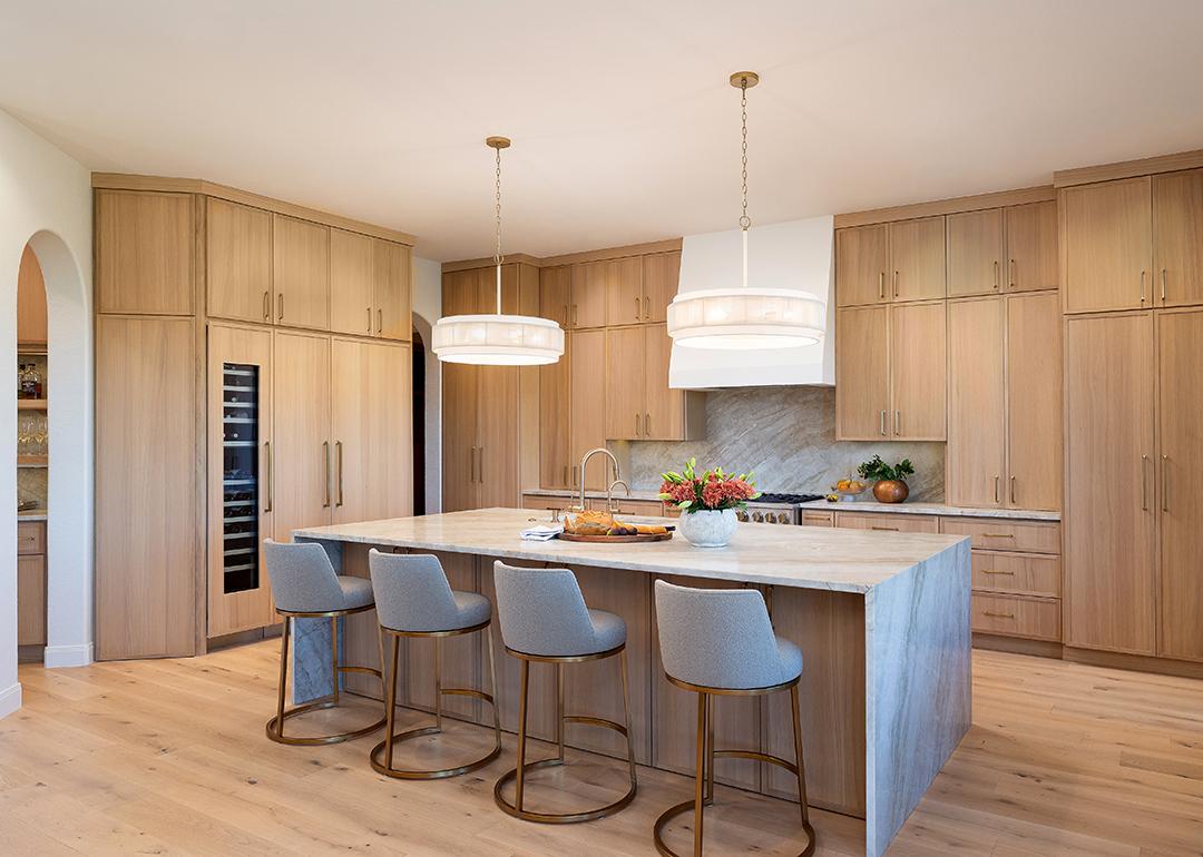 Contemporary kitchen with light wood flooring and cabinets.
