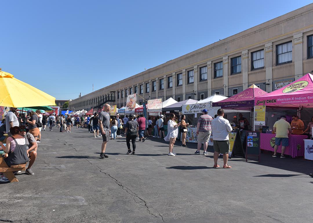 A lane of vendors during Smorgasburg LA, a Sunday outdoor food and shopping market event in California.