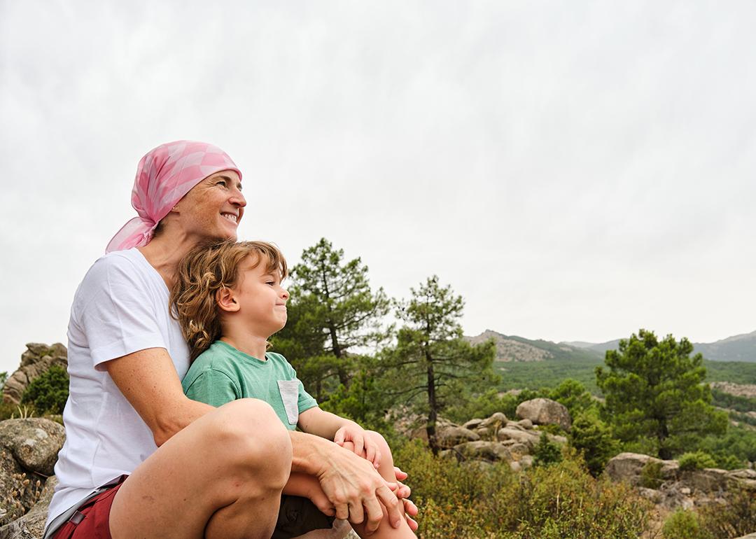 A cancer patient enjoying their time in nature with her child.