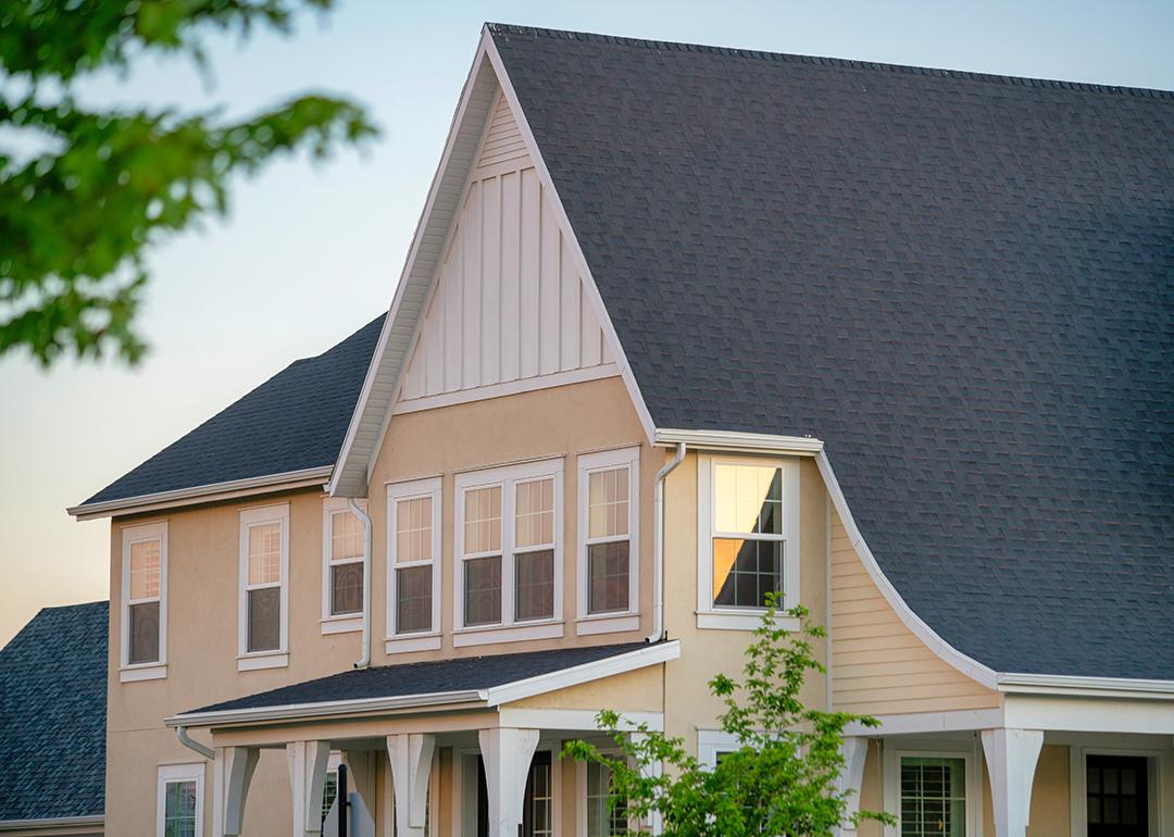 A two-story residential house with gray roofing.