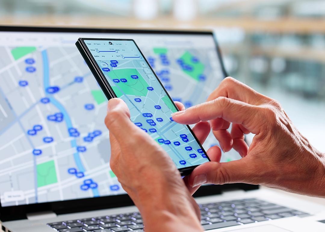 A user tracks property listing in an area using maps.