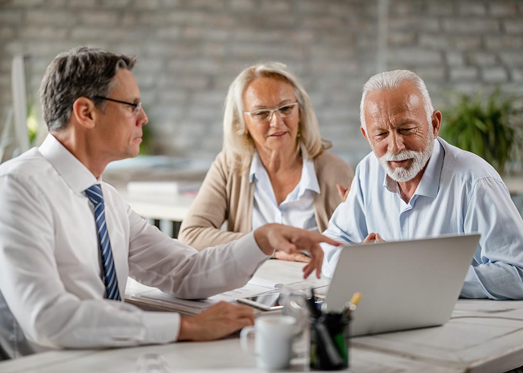 A senior couple having a meeting with a financial advisor.