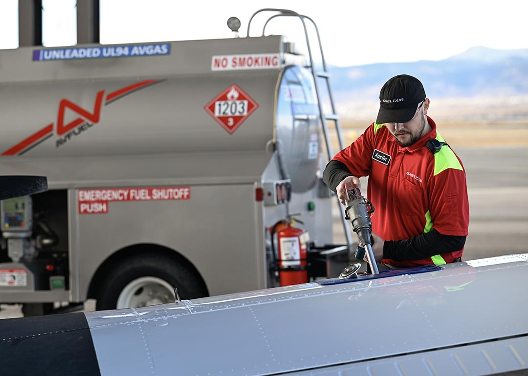 A line service technician refuels a plane using a Federal Aviation Administration approved unleaded aviation fuel at Sheltair at Rocky Mountain Metropolitan Airport.