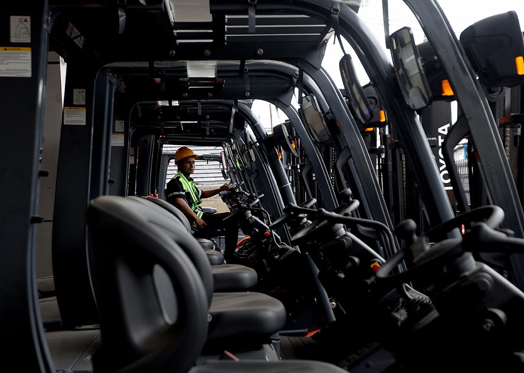 An operating trying out a new electric forklift.