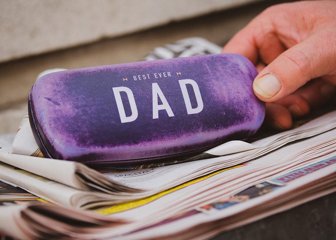 A velvet-covered eyeglasses case with a "Best Ever Dad" inscription.