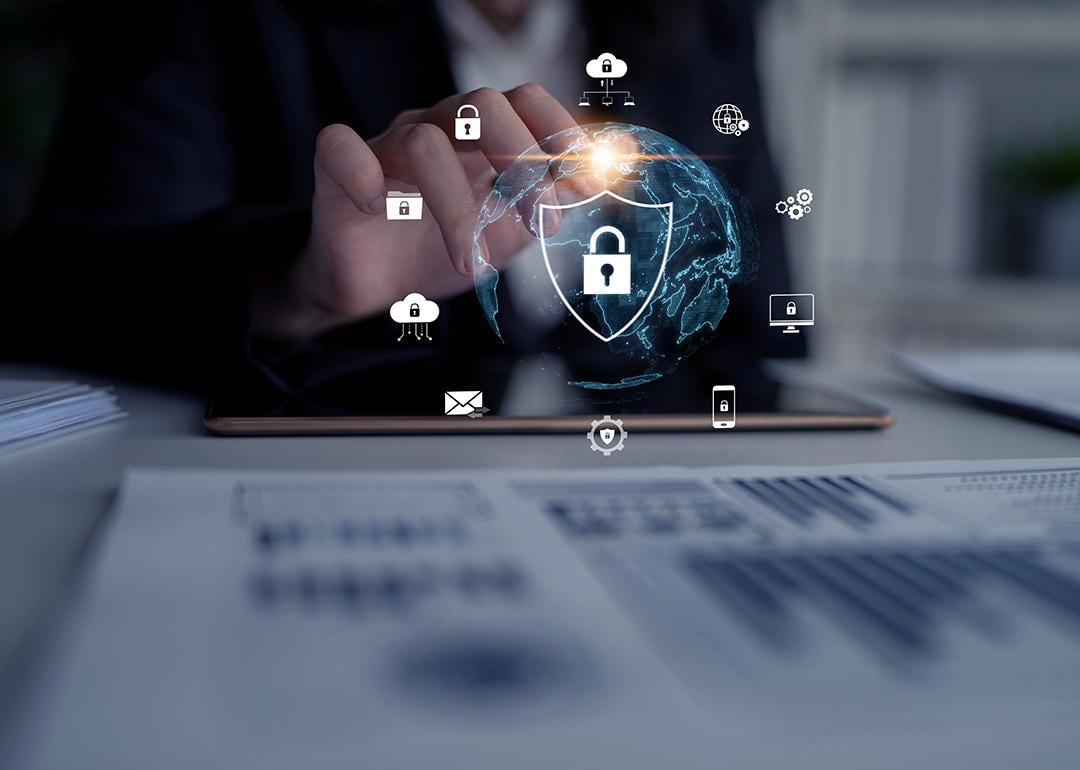 A cyber security analyst protecting digital content against breaches, hacks, and network attacks using defense strategies and tools. 
