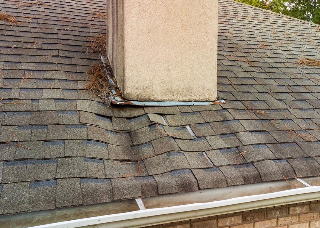 A roof's shingles damaged from a water leak.