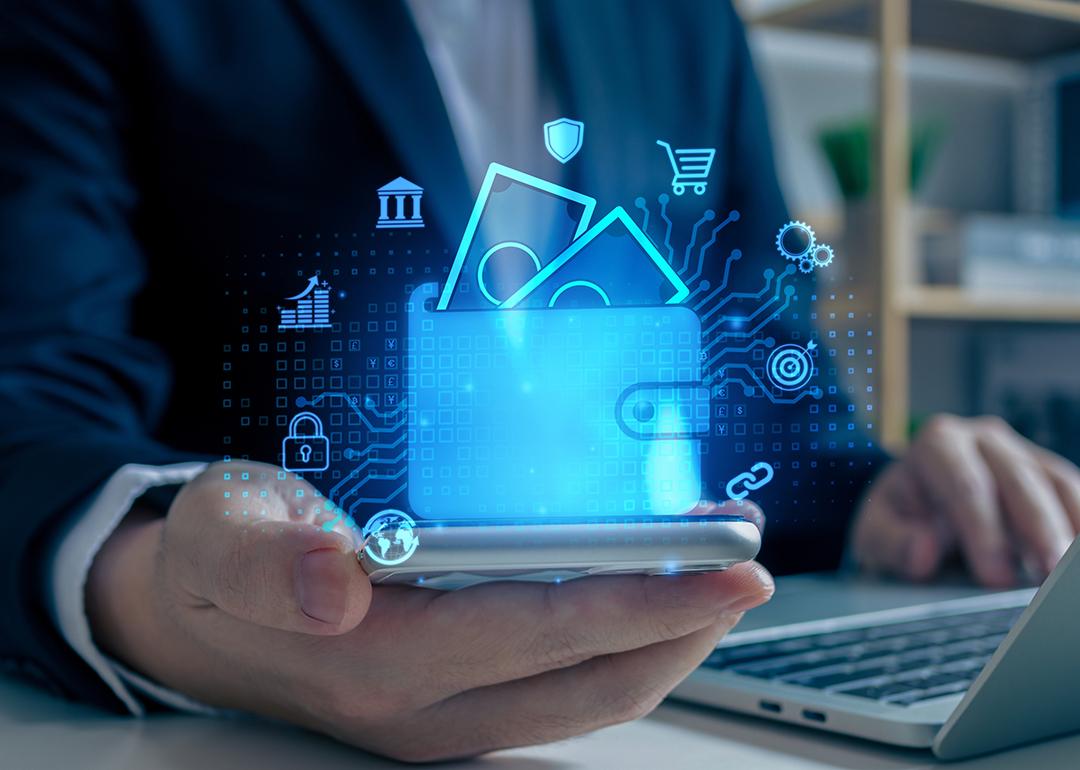 Digital wallet graphics over a businessman using a phone as a concept of digital banking.