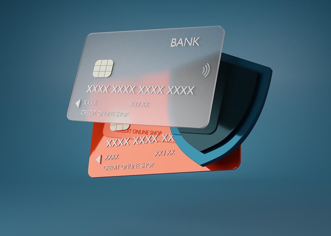 A 3D illustration of a credit card and a shield symbolizing digitial financial security. 