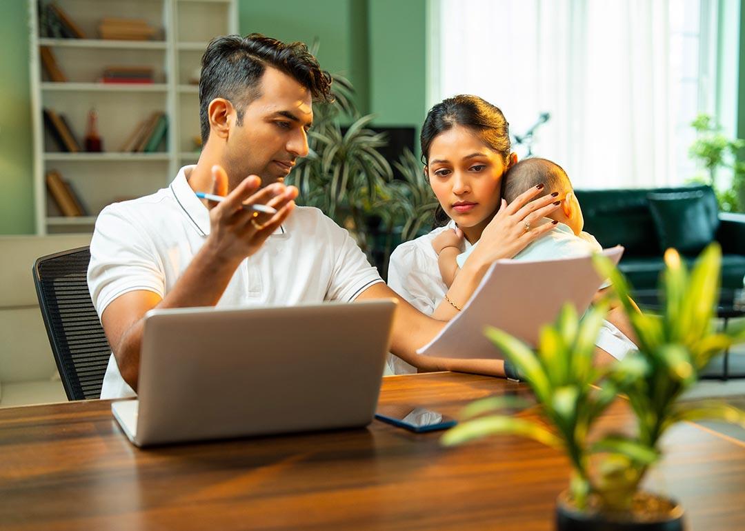A married couple discussing about family matters and budget at home.