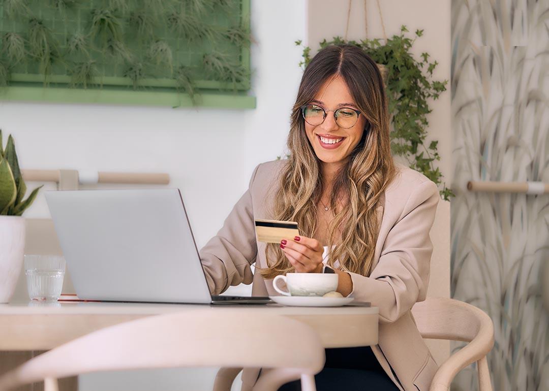 A businesswoman making digital payments with her credit card.
