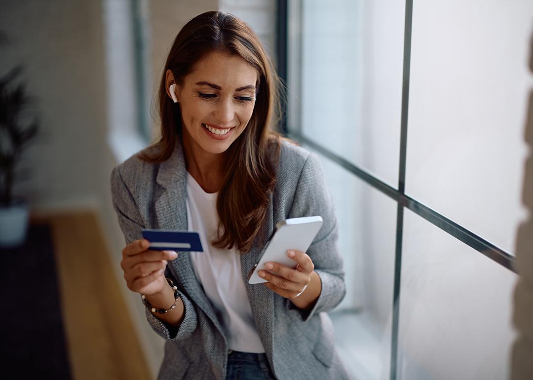 A female entrepreneur paying an online purchase with a credit card.