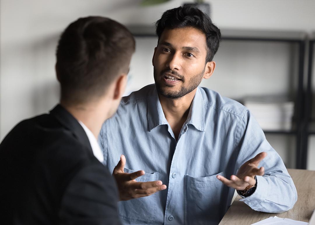 A young businessman consulting with a financial advisor.