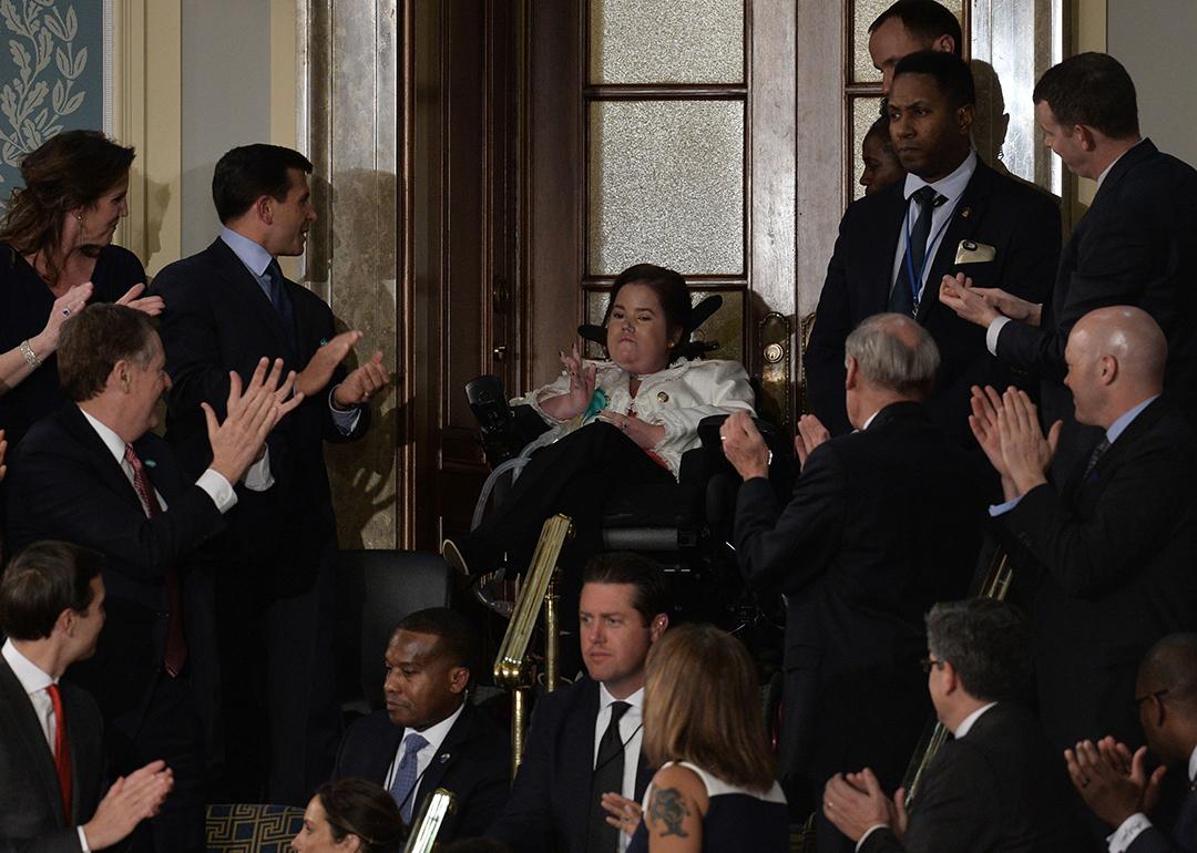 Megan Crowley (C), a Pompe Disease patient, applauded as US President Donald Trump addresses a joint session of the US Congress on February 28, 2017 at the Capitol in Washington, DC. 