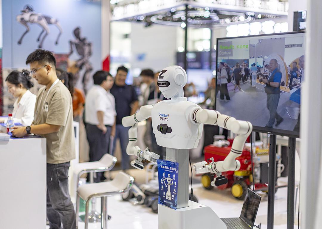 An exhibitor for AI and robot manufacturing during the 2026 World Intelligent Industry Expo in Tianjin, China.