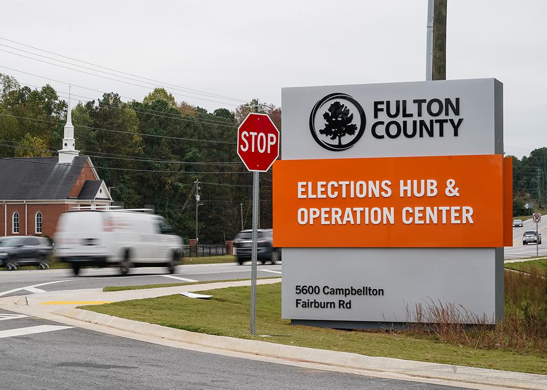 Vehicles pass by the sign for the Fulton County Elections Hub and Operations Center on November 4, 2024, in Union City, Georgia. 