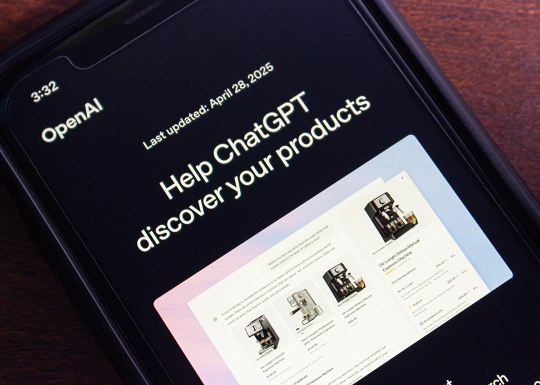 Close-up of a smartphone screen showing OpenAI's website with the ‘Help ChatGPT discover your products’ page.