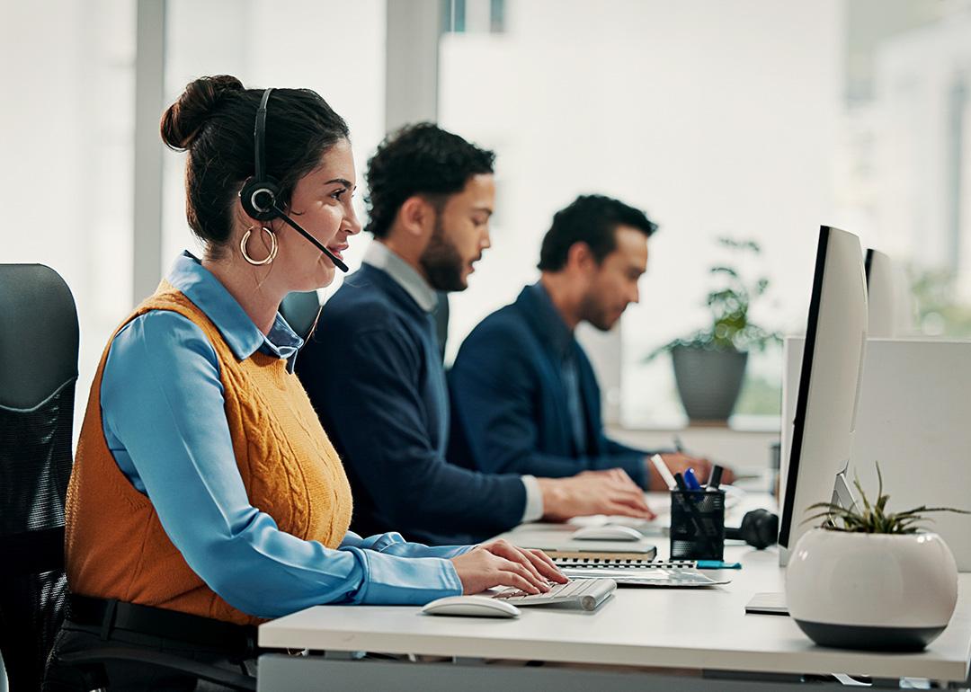 A call center employee talking with a customer over a call for solution support.