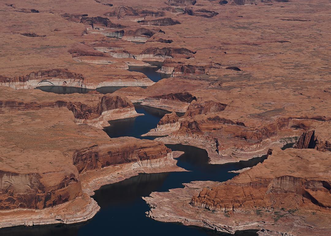 A bathtub ring marks the receded shoreline at Lake Powell, where water levels remain low in Glen Canyon National Recreation Area on April 30, 2026, near Big Water, Utah. 