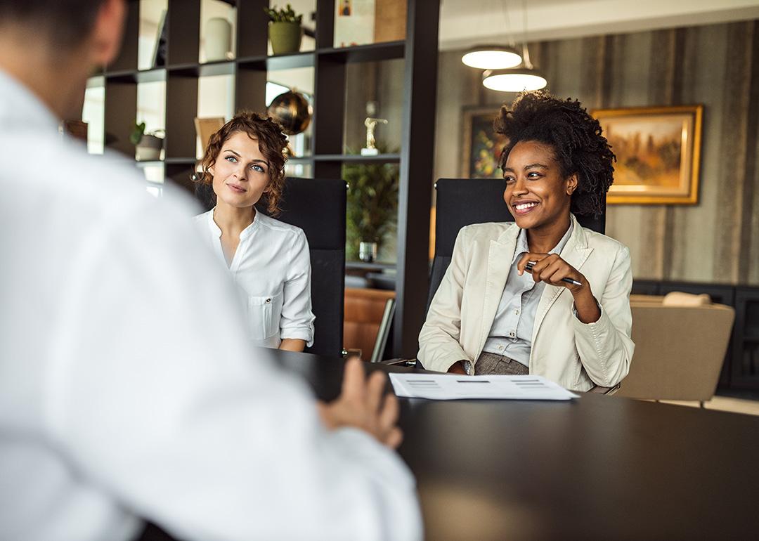 Business managers collaborating during a meeting with a prospective partner. 