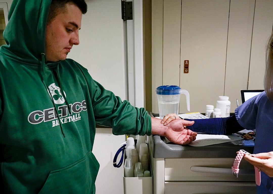 Stephen Barber being checked by a nurse before receiving a dose of suboxone at Serenity at Summit rehabilitation center in Haverhill, Massachusetts, USA.
