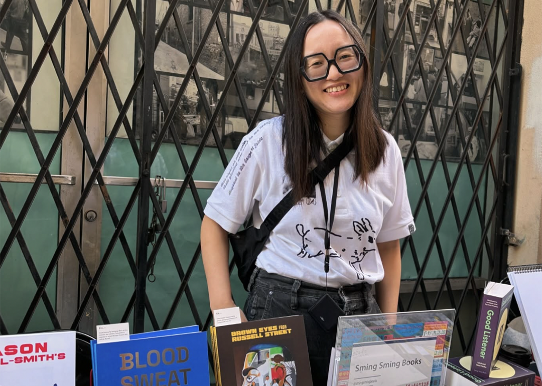 Artist-publisher Vivian Sming posing for a photo in the Sming Sming Books booth.
