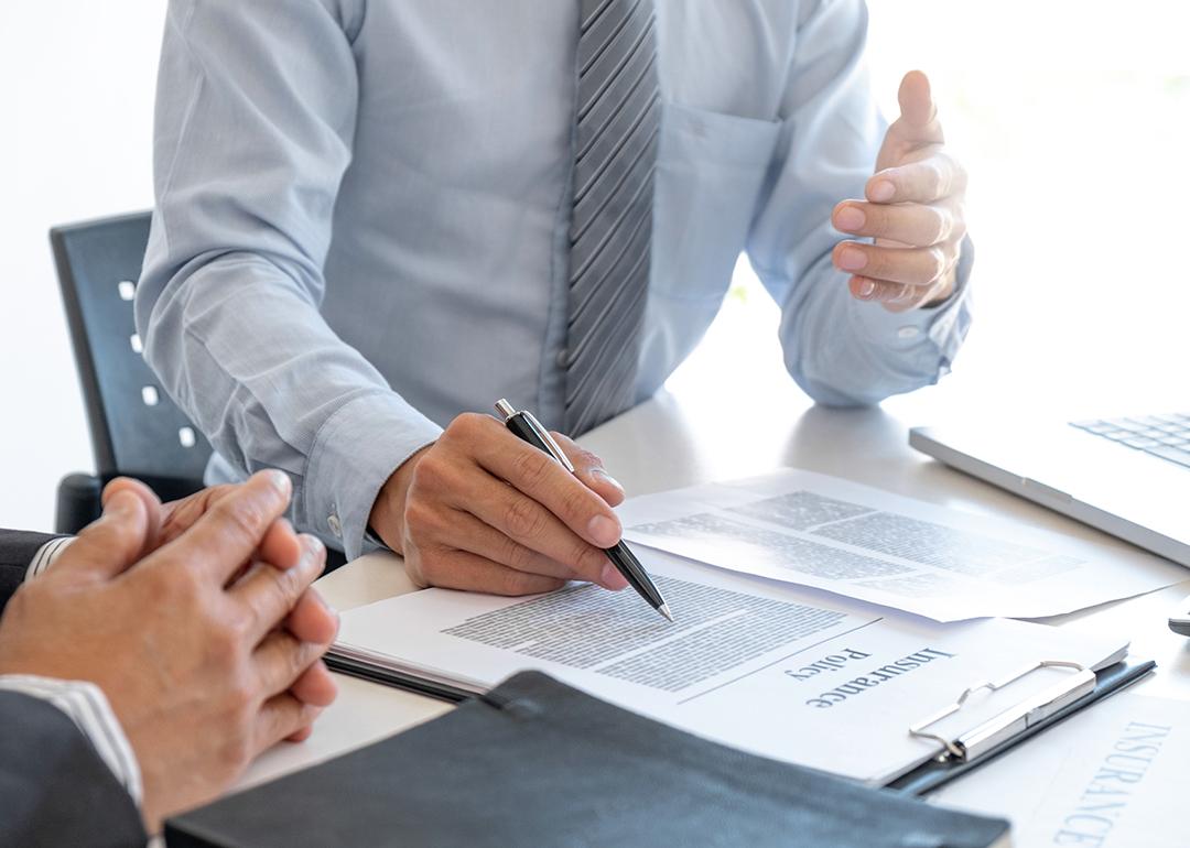 An insurance agent explaining a policy to a customer.