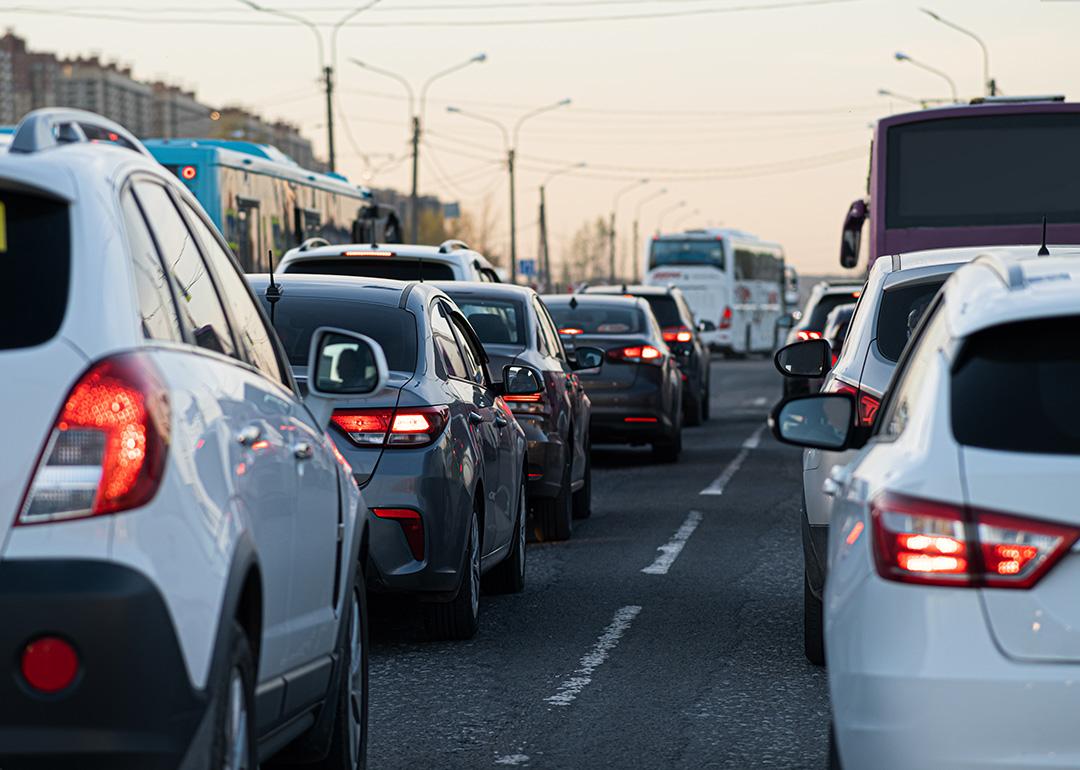 Traffic jamming during rush hour in the city neighborhood at early evening.