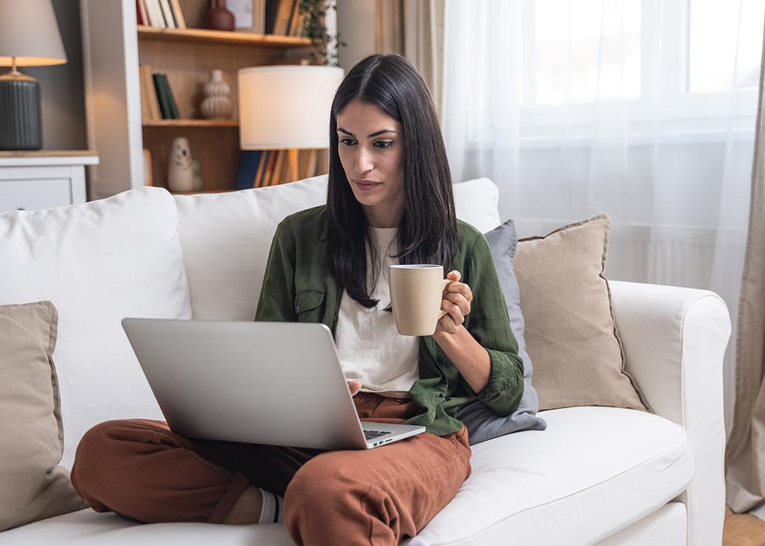 A person checking through her earnings from an online business in a laptop.