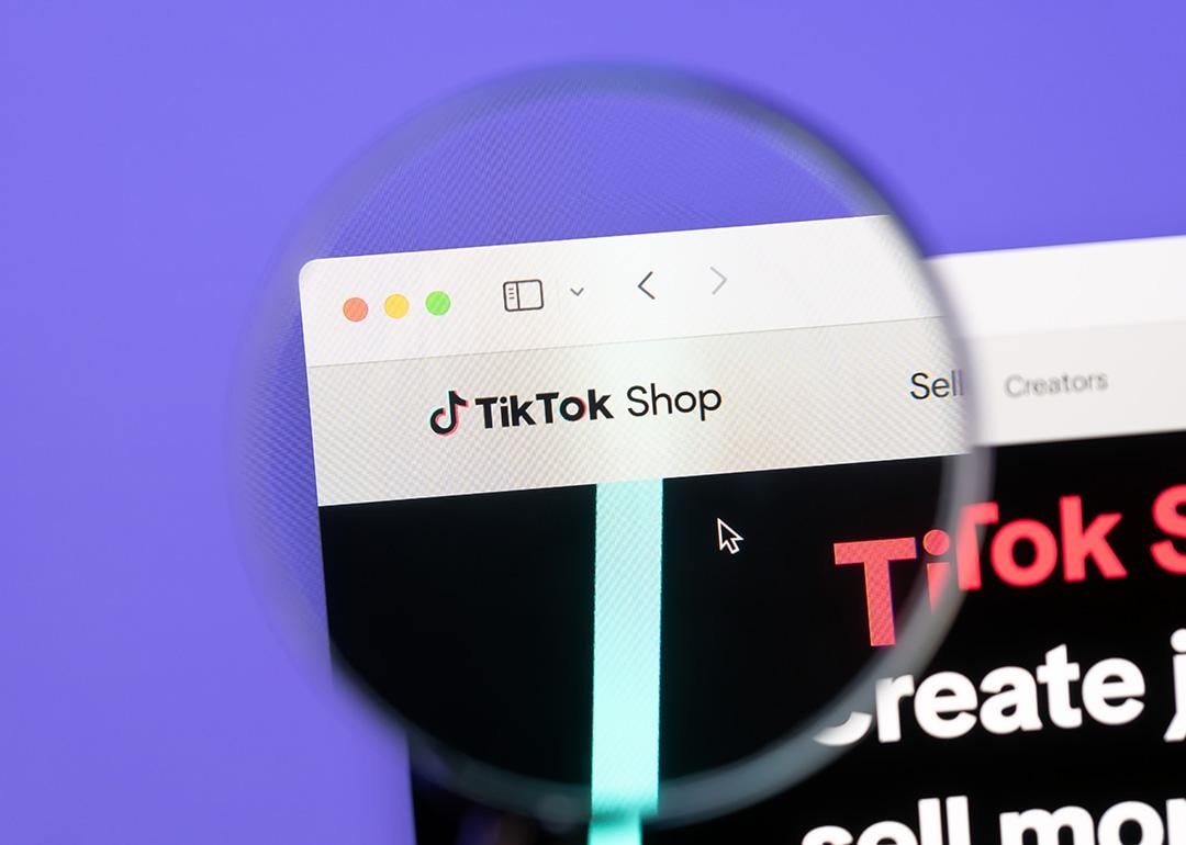 A focused shot of Tiktok Shop brand's webpage through magnified lens.