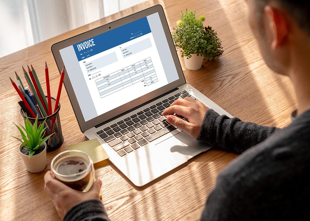 A finance professional working on an invoice.