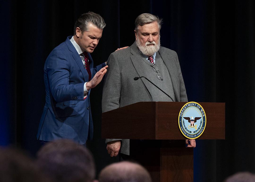 Pete Hegseth and Douglas Wilson stand at a podium during a Pentagon prayer service in February 2026.