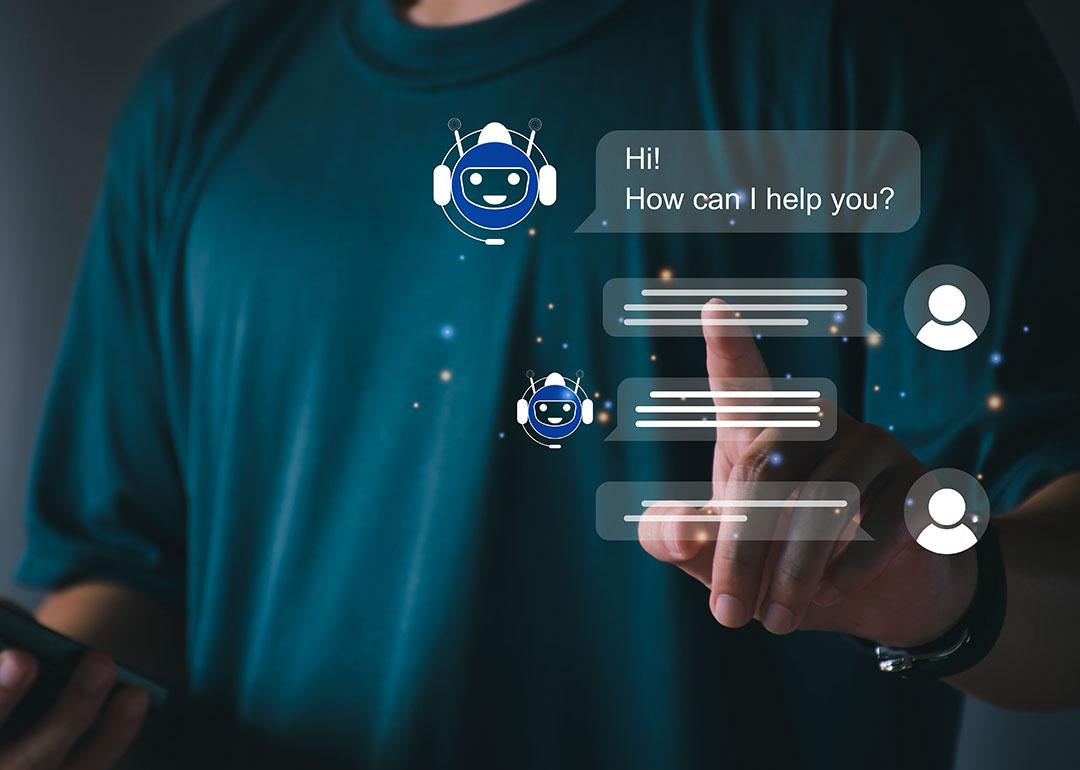 A person utilizing an AI chatbot that responds to online messages or inquiries.