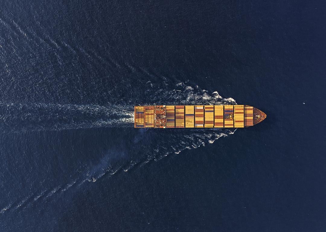 Aerial view of a large cargo ship traveling at sea.