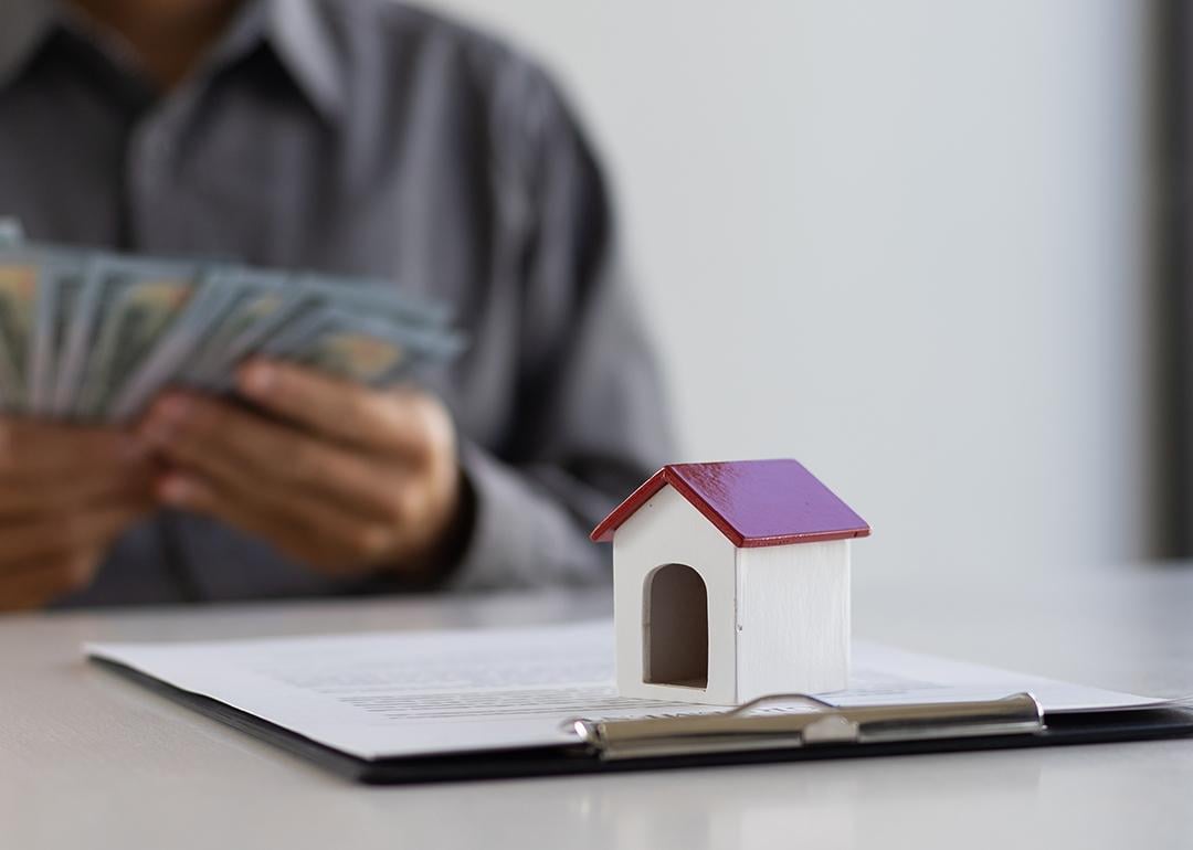 A real estate agent counting cash payment after closing a deal.