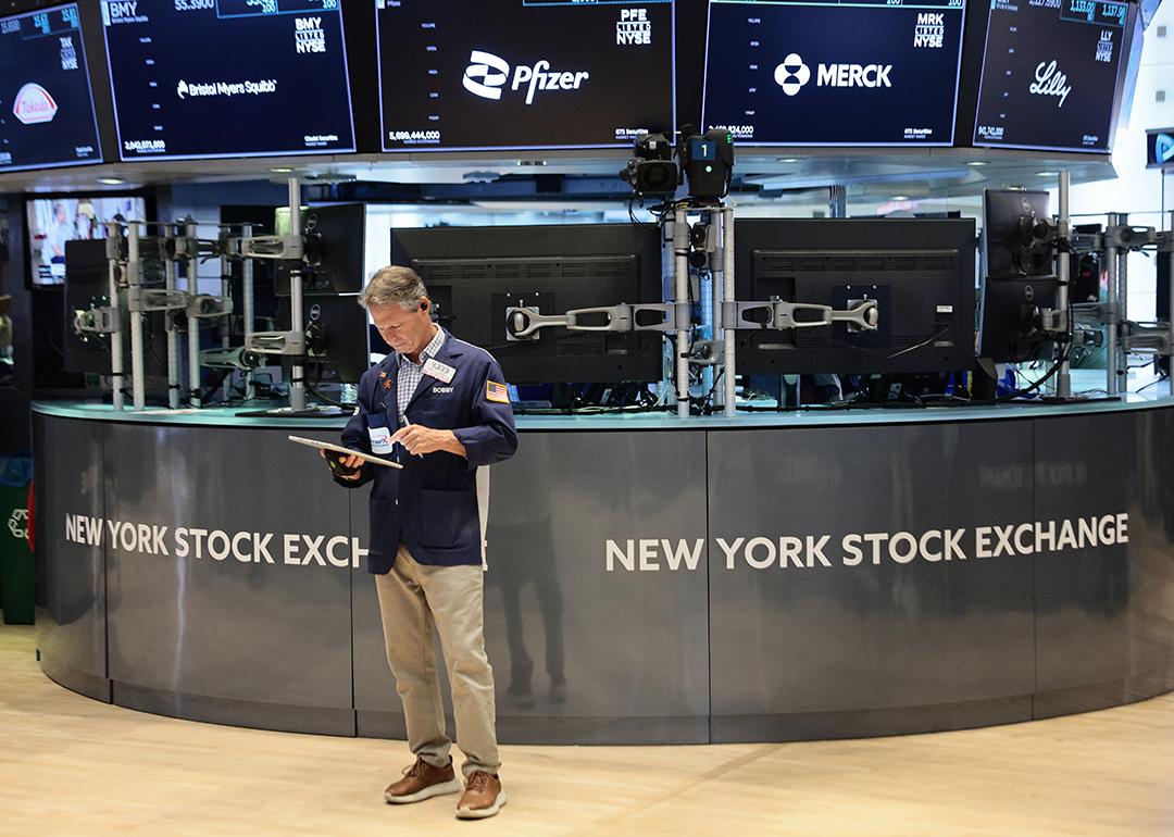 Traders work on the floor of the New York Stock Exchange during morning trading on June 26, 2026 in New York City. 