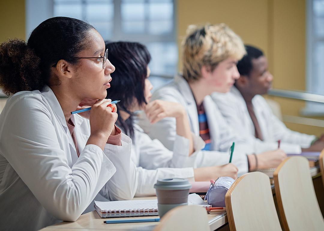 A class of medical students attentively listening to a lecture.
