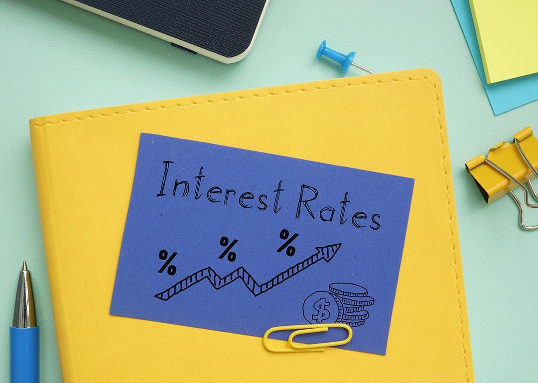 A notebook labeled with interest rates and an illustration. 