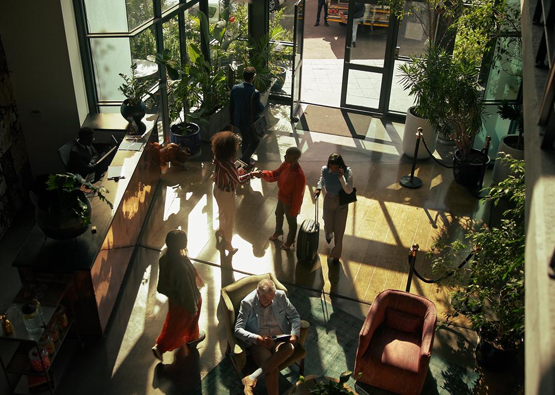 Guests arriving to check in at a hotel lobby.