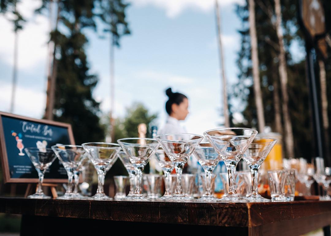 Empty martini glasses on an open bar.