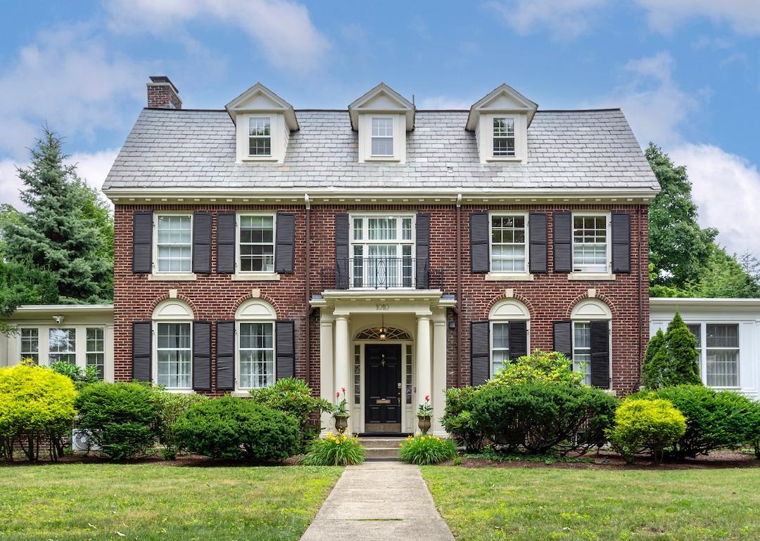 A colonial revival brick house in Newton, Massachusetts.