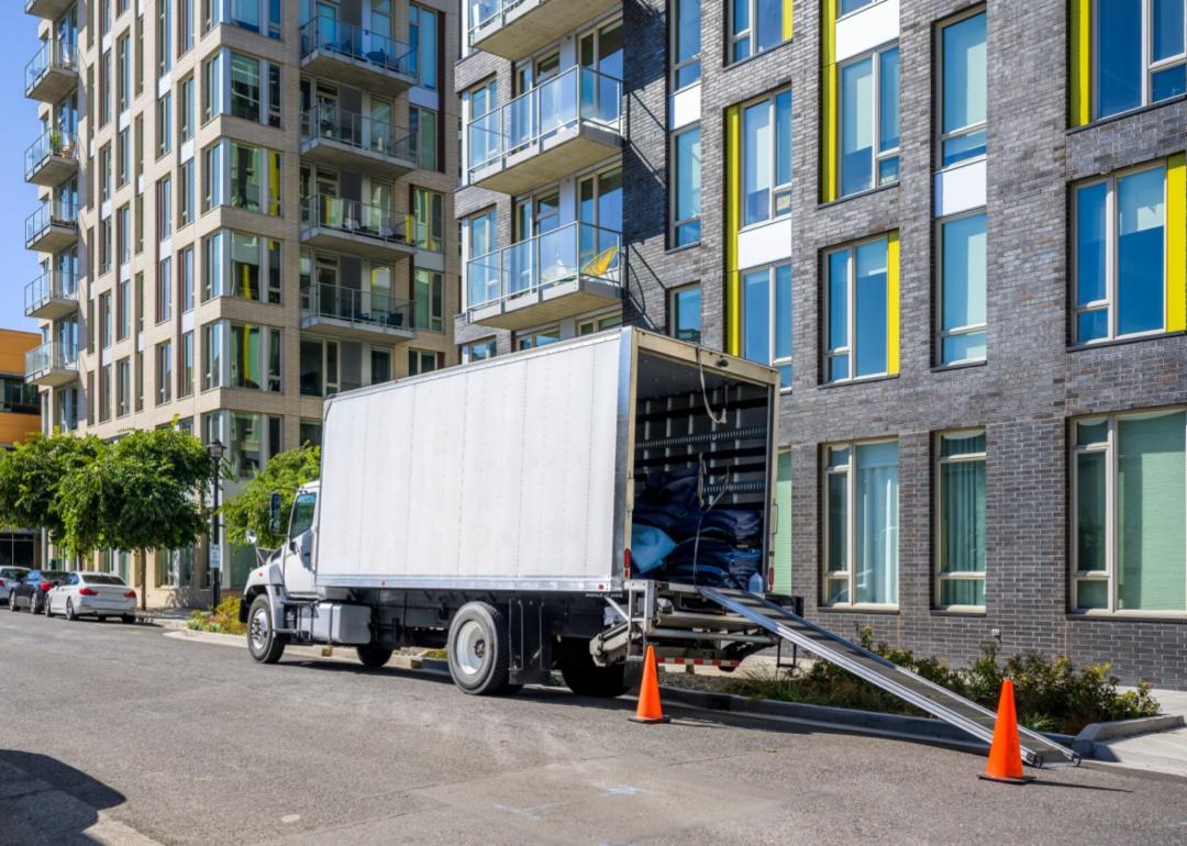 A moving truck in the city.