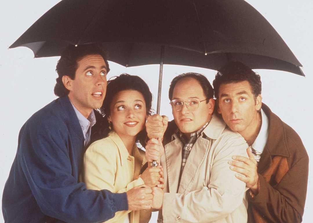 Actors Jerry Seinfeld, Julia Louis-Dreyfus, Jason Alexander, and Michael Richards pose for a promotional photo for 'Seinfeld' in 1997.