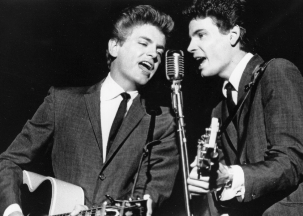The Everly Brothers perform onstage.